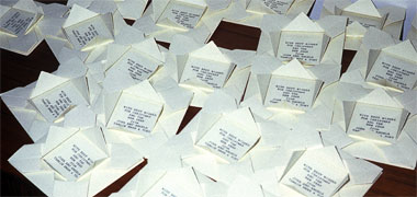 A number of folded cards awaiting sending