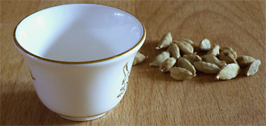 An Arabic coffee cup or finjaan with cardamon seeds