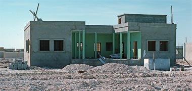 The standard courtyard house under construction, January 1976