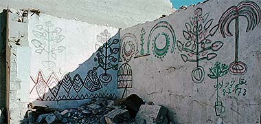 The decorative treatment of an internal wall with plant motifs