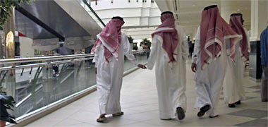 Young Qataris walking in a modern shopping centre