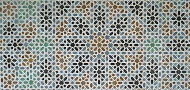 A subtle mosaic patterning from the Alcázar, the Royal Palace, Seville, Andalusia