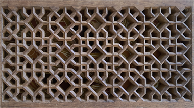 A simple carved teak grid