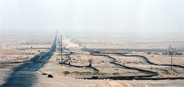 The road to Dukhan with pipelines running beside it, 1972