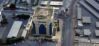 Aerial view of a low tower in the New District of Doha