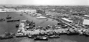 The beginnings of the Corniche and the old port with Government House