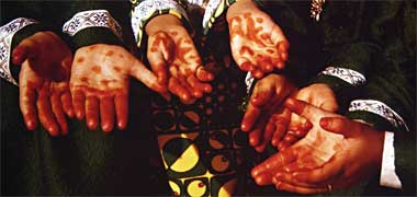 Children with henna on their hands