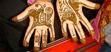 Hands decorated with henna paste
