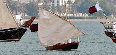 A kitr under sail in the West Bay at Doha