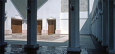 The reflecting pool and courtyard inside the Ibn al Khattab mosque in Doha