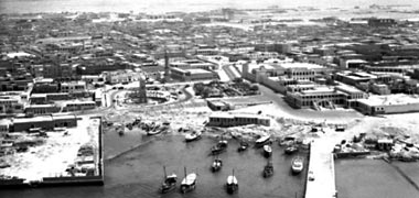 Sheikh Ali’s compound, jetty, Clock Tower and mosque around 1956
