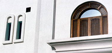 Mushrabiyah partially protecting a window, and a narrow treatment 